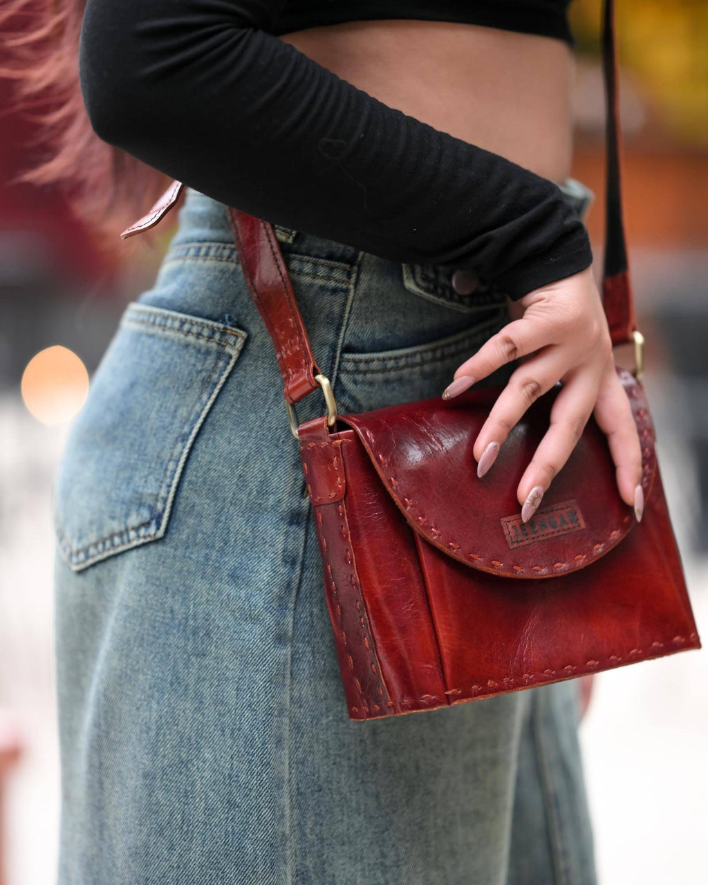 The Beawar Sling in Cherry — saddle-stitched real leather sling bag