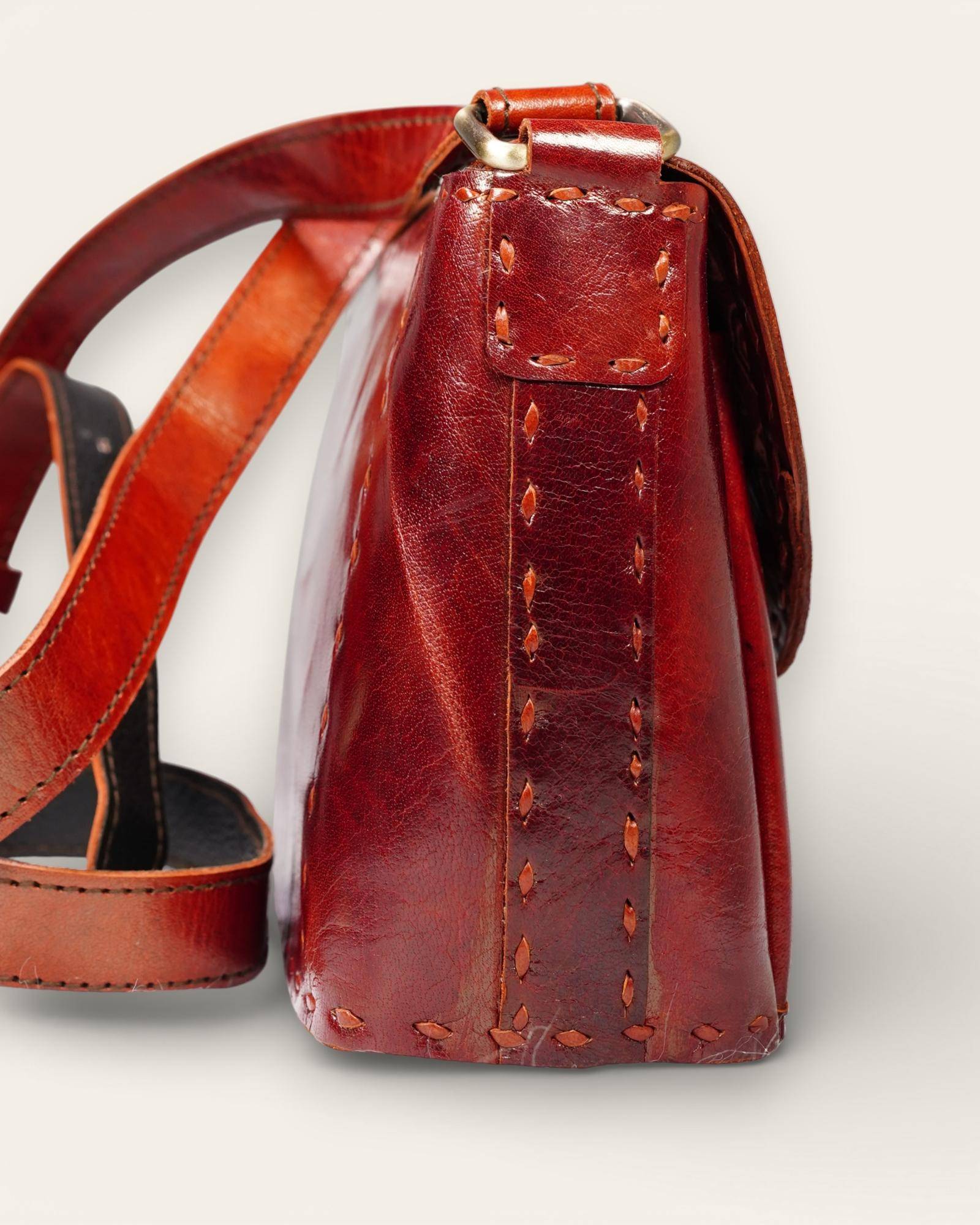 The Beawar Sling in Cherry — handcrafted leather sling by artisan Manish