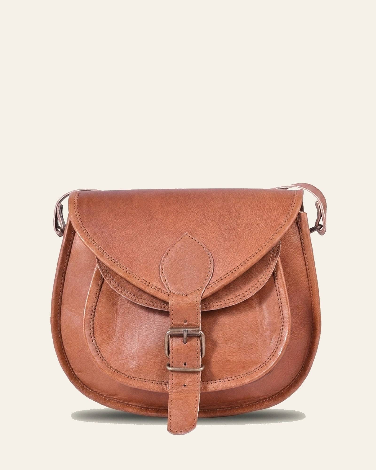 The Marwari Sling in Tan — front with pocket and buckle
