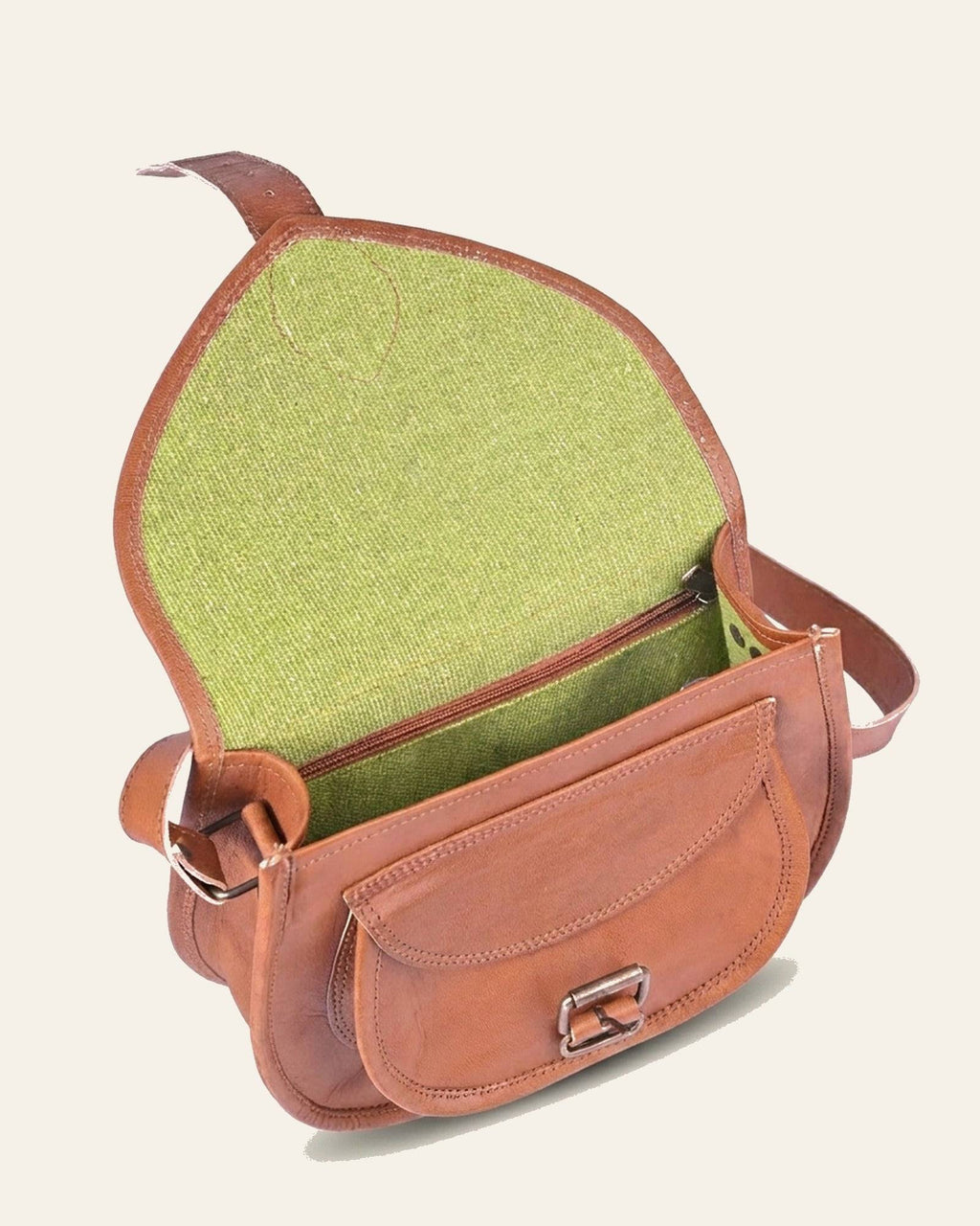 The Marwari Sling in Tan — open, green canvas-lined interior