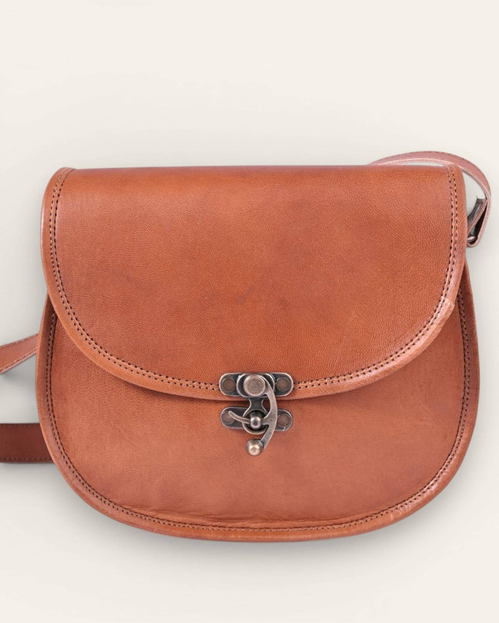 The Udaipur Saddle Bag — handcrafted tan leather saddle bag by Jeengar, front view