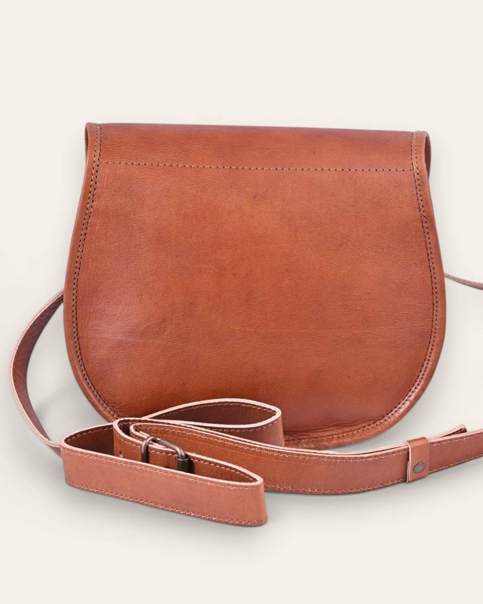 The Udaipur Saddle Bag — equestrian-style leather sling bag made in Rajasthan