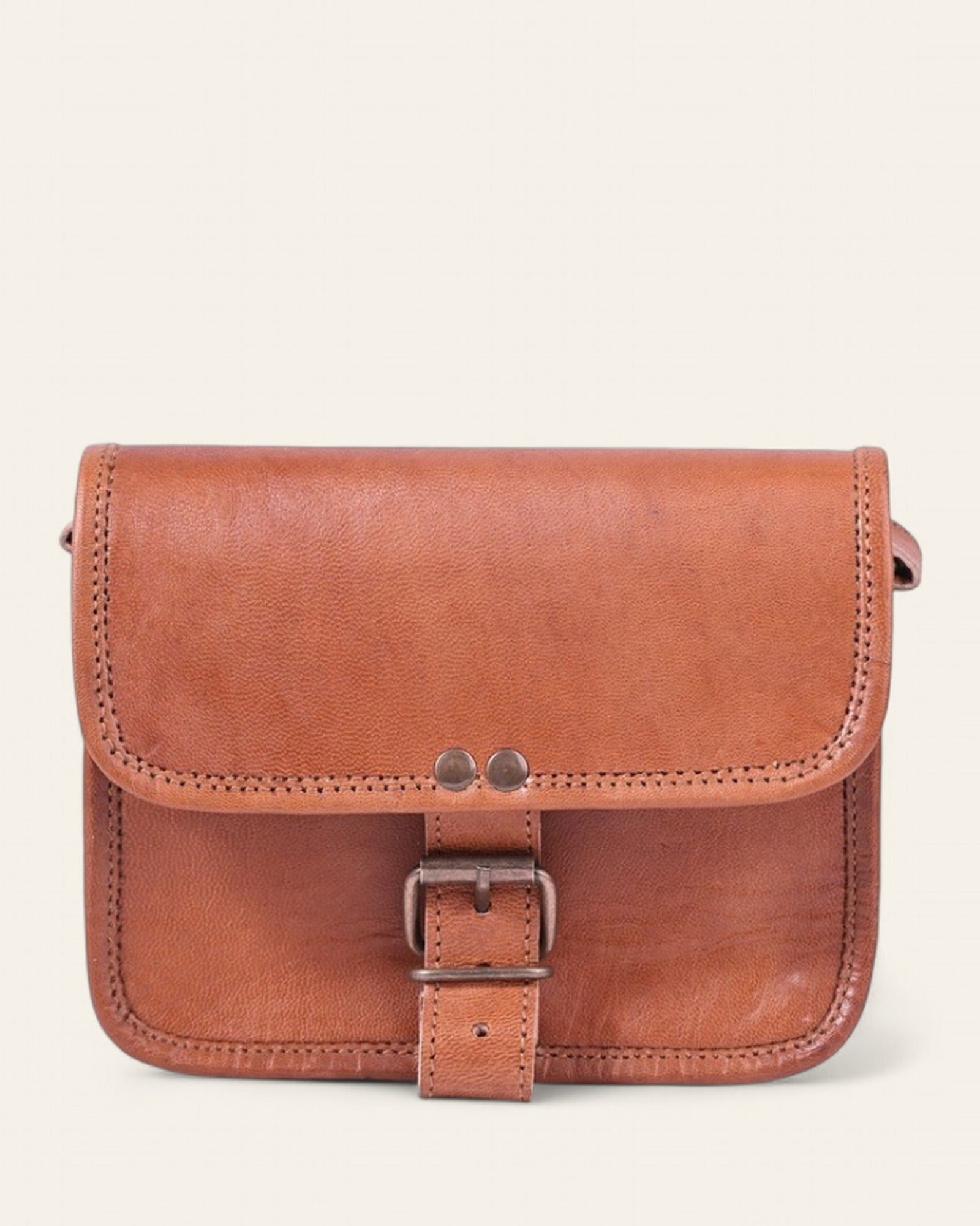 The Alwar Mini Satchel — handcrafted tan real leather mini satchel by Jeengar, front view