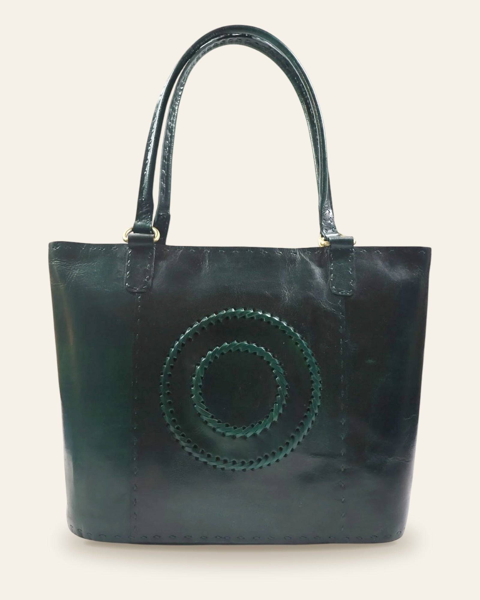 The Rambagh Tote — front view with woven medallion in Certified Real Leather